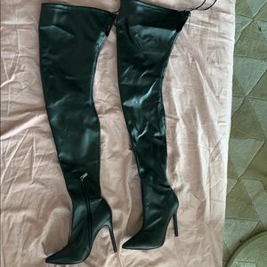 Thigh high black “leather” heel boots